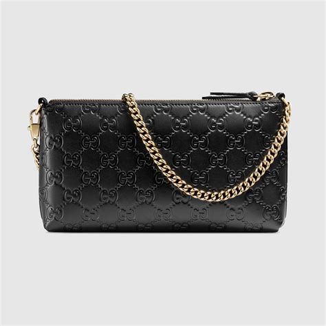 gucci white embossed wrist pouch|Gucci clutches for women.